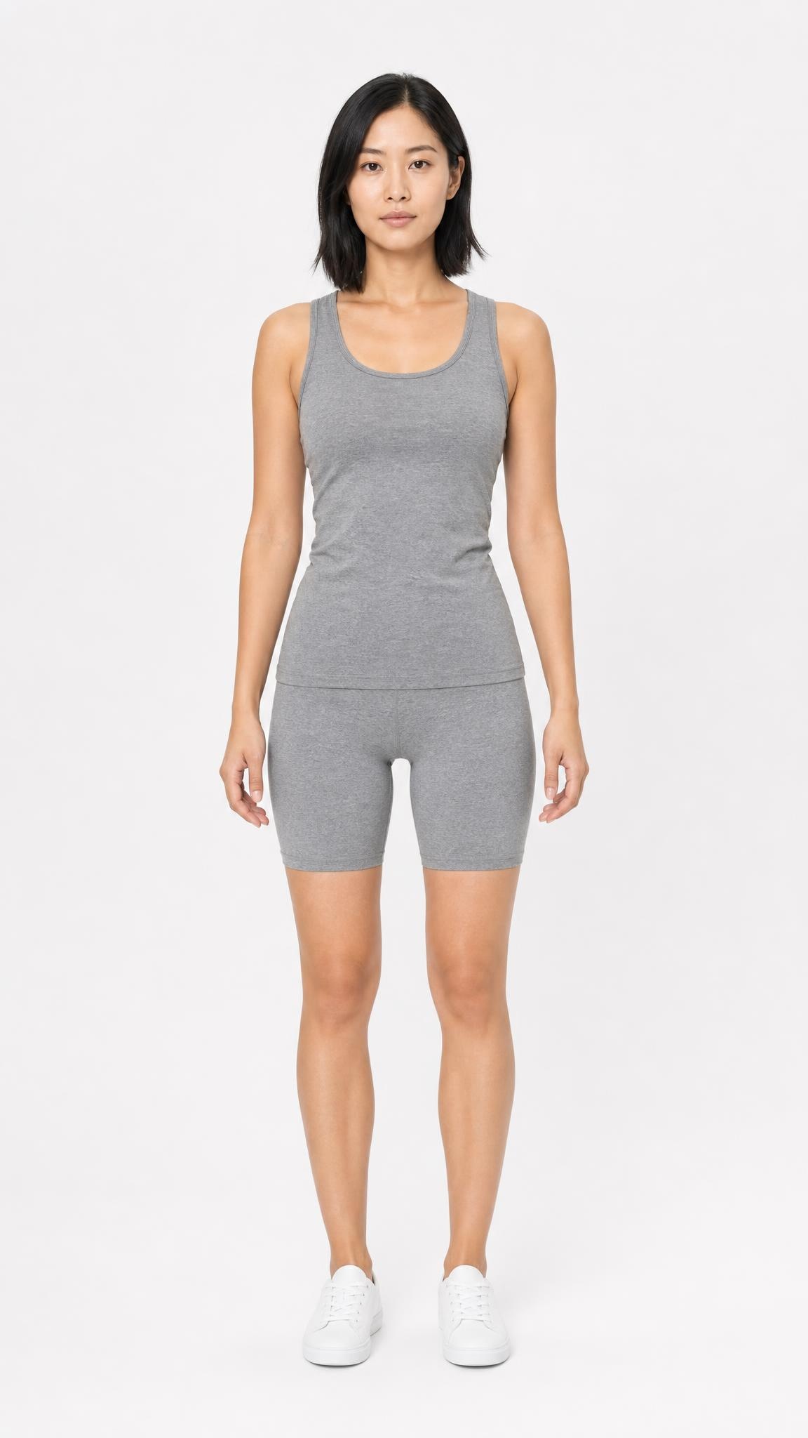 Catalog model in heather-grey tank and bike shorts