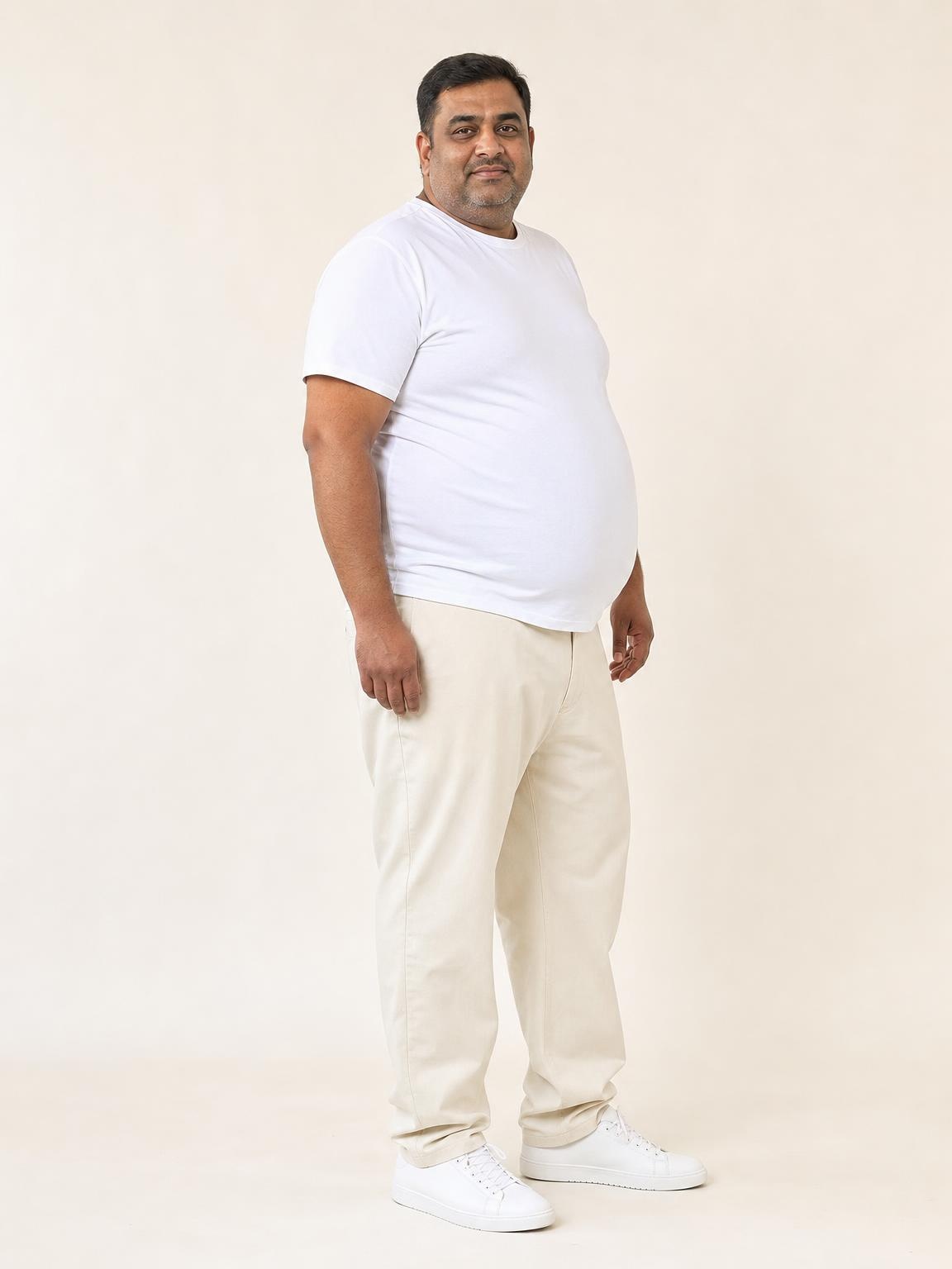 Plus-size South Asian man, three-quarter catalog still